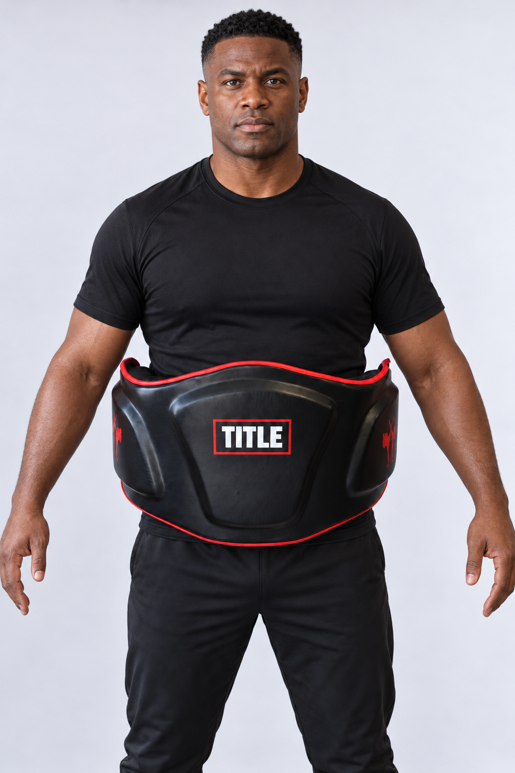 TITLE Bodyshot coaching belly pad in black PU leather with red piping, moulded front panel and red kicker emblems