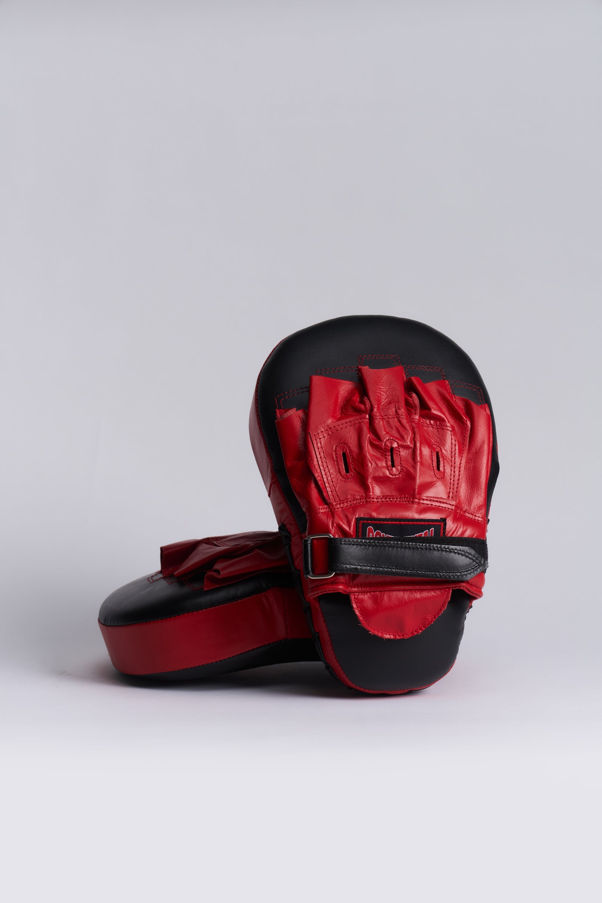 TITLE Boxing South Africa leather curved hook and jab pads with red and black finish and adjustable wrist strap