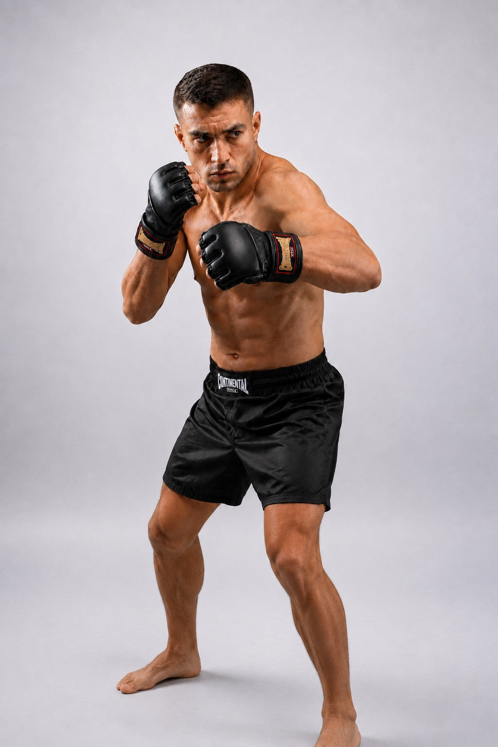 TITLE Boxing South Africa black genuine leather MMA grappling gloves worn by a fighter in a boxing stance